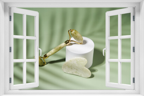 Fototapeta Naklejka Na Ścianę Okno 3D - Green jade face roller and Gua Sha scraping for beauty facial massage therapy