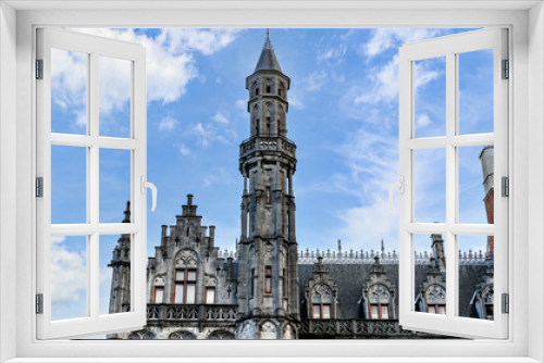 Fototapeta Naklejka Na Ścianę Okno 3D - Views of the Historium tower on the market square in Bruges, Belgium