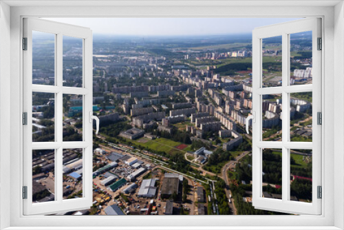 Fototapeta Naklejka Na Ścianę Okno 3D - City, locality. Construction site, residential area on a sunny summer day. Apartment buildings, high-rise buildings. The view from the drone, from above.