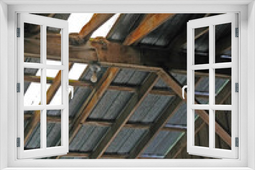 Fototapeta Naklejka Na Ścianę Okno 3D - Bird nests in the rafters of and old barn