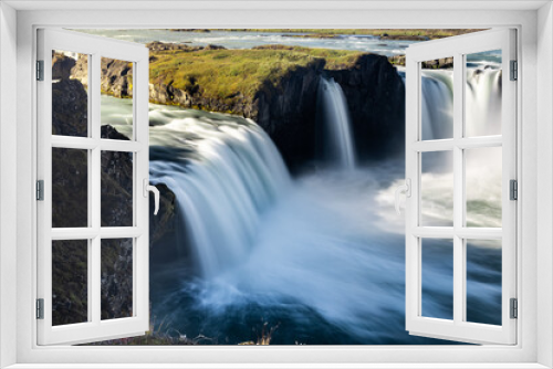 Fototapeta Naklejka Na Ścianę Okno 3D - Godafoss Waterfall in Iceland is nicknamed the Waterfall of the Gods. Some believe that the name comes from the fact that the waterfall is god-like in beauty.