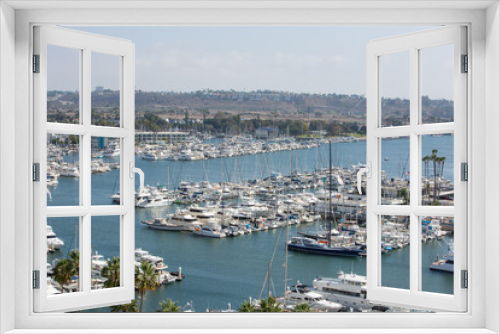 Fototapeta Naklejka Na Ścianę Okno 3D - Marina Del Rey, California, USA – October 12, 2022: High Close-up View of Yacht Clubs at Marina Del Rey with Beach, Boat Pier Docks, Boats, and Houses