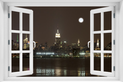Fototapeta Naklejka Na Ścianę Okno 3D - The New York City mid-town skylines at night