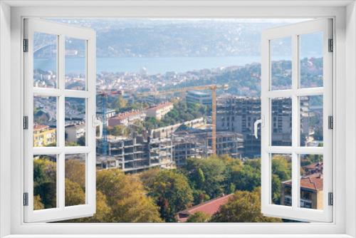 Fototapeta Naklejka Na Ścianę Okno 3D - Construction and Cranes Next to the Bosphorus