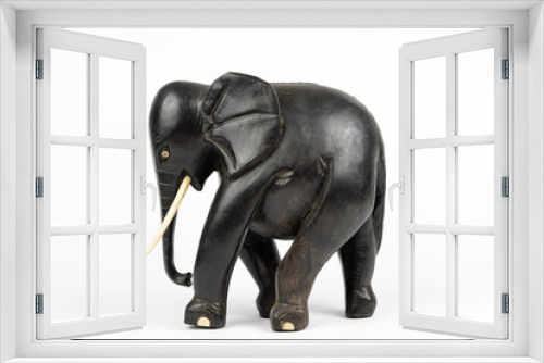Fototapeta Naklejka Na Ścianę Okno 3D - wooden statue of a black african elephant with ivory tusks and toes, isolated on white blackground 
