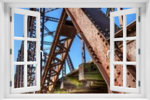 Fototapeta Naklejka Na Ścianę Okno 3D - Old rusted girders of a railway bridge