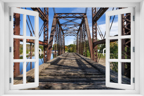 Fototapeta Naklejka Na Ścianę Okno 3D - Old rusted girders of a railway bridge