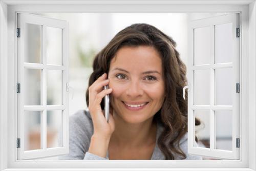 Woman calling with cellphone  in living room