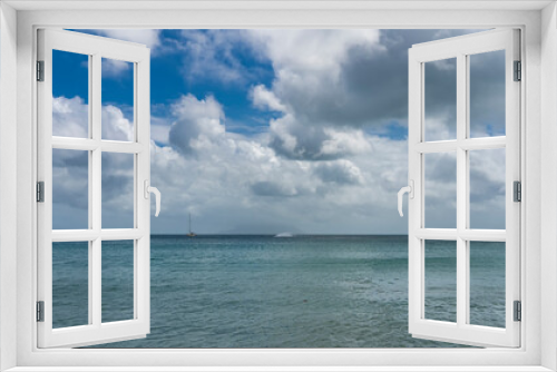 Fototapeta Naklejka Na Ścianę Okno 3D - Serene seascape. The turquoise ocean is calm. Yachts and boats are visible on the horizon. Clouds in the blue sky. Seychelles.