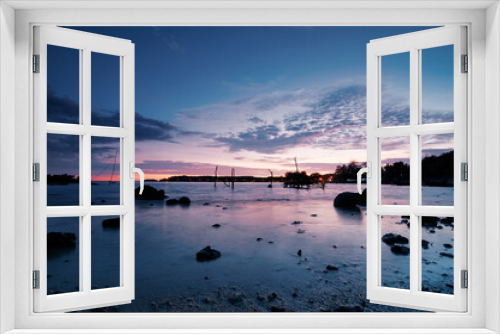 Fototapeta Naklejka Na Ścianę Okno 3D - Beautiful seascape with colorful sky. Sunset and night time on the rock beach.
