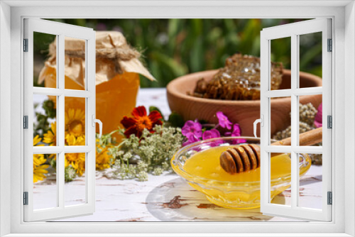 Fototapeta Naklejka Na Ścianę Okno 3D - Delicious honey, combs and different flowers on white wooden table in garden. Space for text