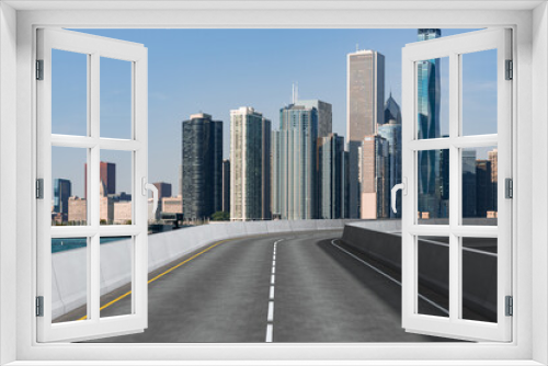 Fototapeta Naklejka Na Ścianę Okno 3D - Empty urban asphalt road exterior with city buildings background. New modern highway concrete construction. Concept of way to success. Transportation logistic industry fast delivery. Chicago. USA.