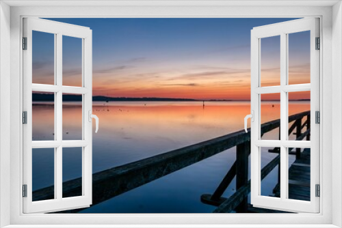 Fototapeta Naklejka Na Ścianę Okno 3D - Sunrise from a Pier in Harrislee on the Baltic Sea