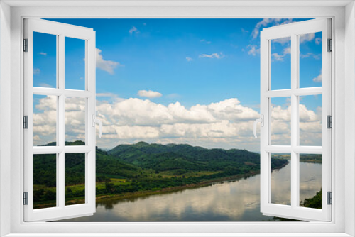 Fototapeta Naklejka Na Ścianę Okno 3D - mountains and sky  In the quiet countryside on the banks of the Mekong River