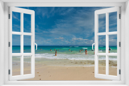 Fototapeta Naklejka Na Ścianę Okno 3D - PLAYA DEL CARMEN, MEXICO - APR 2022: Sexy girl in string tanga bikini on the beach on a sunny day in Playa del Carmen, Yukatan, Mexico