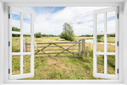 Fototapeta Naklejka Na Ścianę Okno 3D - Wooden gate in a rural summer landscape
