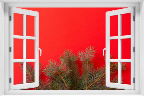 Fototapeta Naklejka Na Ścianę Okno 3D - green fir branches on red christmas background