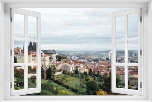 Fototapeta Naklejka Na Ścianę Okno 3D - View of Prague Castle from the hill and the orange roof in harmony with nature