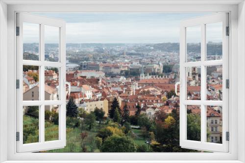 Fototapeta Naklejka Na Ścianę Okno 3D - View of Prague from a hill full of orange roofs