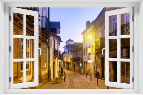 Fototapeta Naklejka Na Ścianę Okno 3D - Evening view of streets and houses of old city of Vila Real at northern Portugal