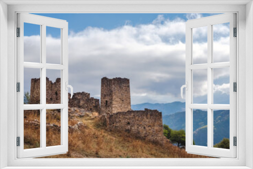 Fototapeta Naklejka Na Ścianę Okno 3D - Majestic ancient tower buildings of Kelly in the Assinesky Gorge of mountainous Ingushetia, one of the medieval castle-type tower villages, located on the extremity of the mountain range, Russia.