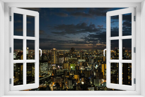 Fototapeta Naklejka Na Ścianę Okno 3D - 梅田スカイビルの空中庭園展望台から見る大阪の夜景