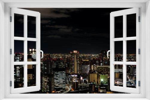 Fototapeta Naklejka Na Ścianę Okno 3D - 梅田スカイビルの空中庭園展望台から見る大阪の夜景