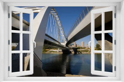 Fototapeta Naklejka Na Ścianę Okno 3D - Modern arc bridge over the river, day traffic, bike road, summer time. modern architecture, panorama of the city Edmonton