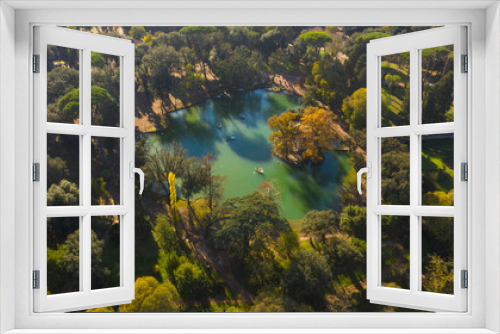 Fototapeta Naklejka Na Ścianę Okno 3D - Aerial view of the small lake in Villa Borghese park. This pond is located in Rome, Italy. There are small row boats with people.