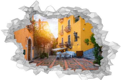 Beautiful old town of Taormina with small streets, flowers. Architecture with archs and old pavement in Taormina. Colorful narrow street in old town of Taormina. Sicily, Italy.