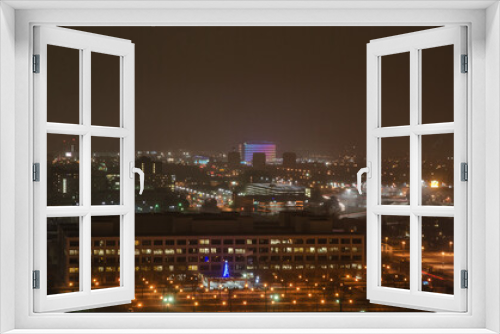 Fototapeta Naklejka Na Ścianę Okno 3D - View of Downtown Detroit from the Fisher Building at night on a cloudy day.
