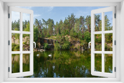 Fototapeta Naklejka Na Ścianę Okno 3D - beautiful lake with a canyon on which swans swim with a blue sky