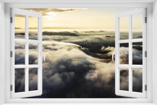 Fototapeta Naklejka Na Ścianę Okno 3D - Aerial view of landscape Sunrise above clouds dramatic light