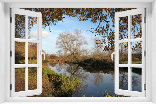 Fototapeta Naklejka Na Ścianę Okno 3D - Winter reflections on the River Wey in Guildford on a cold sunny day.