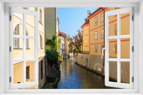 Fototapeta Naklejka Na Ścianę Okno 3D - Houses by the canal in a cozy touristic European city. Background with selective focus