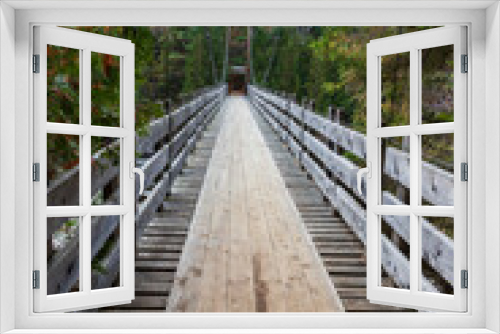 Fototapeta Naklejka Na Ścianę Okno 3D - Wooden bridge at Ouareau forest. Quebec. Canada.