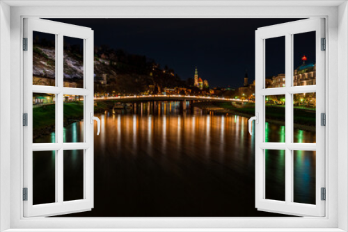 Night view across the River Salzach in Salzburg, Austria