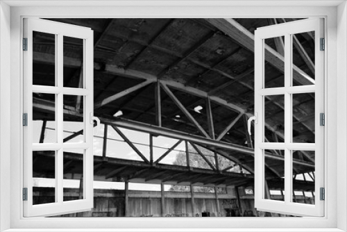 Fototapeta Naklejka Na Ścianę Okno 3D - Old arched metal structures abandoned air hangar.
