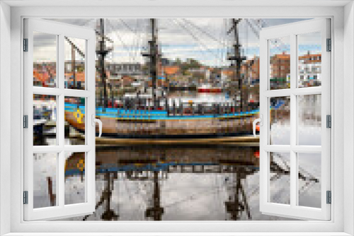 Fototapeta Naklejka Na Ścianę Okno 3D - Old galleon reflected in a harbour