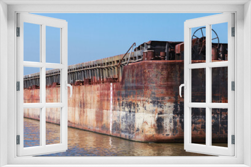 Fototapeta Naklejka Na Ścianę Okno 3D - Rusty barge at Danube river on a sunny day