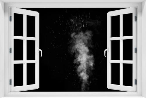 Fototapeta Naklejka Na Ścianę Okno 3D - A white curly steam with a spray of drops rising up is isolated on a black background to overlay your photos