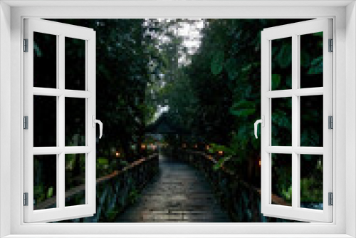 Fototapeta Naklejka Na Ścianę Okno 3D - Candlelit walkway in the Jungle Resort on the Kinabatangan River