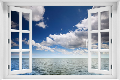 Fototapeta Naklejka Na Ścianę Okno 3D - Cloudy blue sky above a surface of the sea