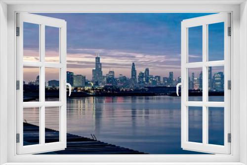 Fototapeta Naklejka Na Ścianę Okno 3D - Downtown Chicago and Lake Michigan During the Blue Hour as viewed from just off of Lake Shore Drive near the 49th Street Beach