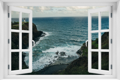 Fototapeta Naklejka Na Ścianę Okno 3D - Kilauea Point Lighthouse glowing in the summer sun against a blue sky and ocean, Kauai, Hawaii, USA