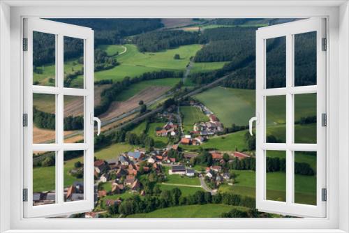 Fototapeta Naklejka Na Ścianę Okno 3D - View from a motor glider over the picturesque landscape of Franconian Switzerland/Germany with small villages