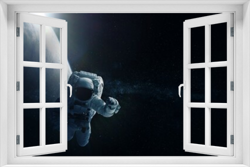 Fototapeta Naklejka Na Ścianę Okno 3D - Astronaut and Earth. Elements of this image furnished by NASA.