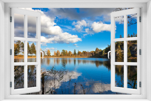 Fototapeta Naklejka Na Ścianę Okno 3D - Lake in Sweden reflecting the late summer sky