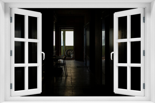 Fototapeta Naklejka Na Ścianę Okno 3D - Interior light from window. Dark corridor and light at end. Reflection on floor.
