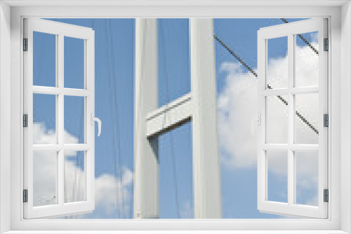 Fototapeta Naklejka Na Ścianę Okno 3D - Suspension bridge support against blue sky